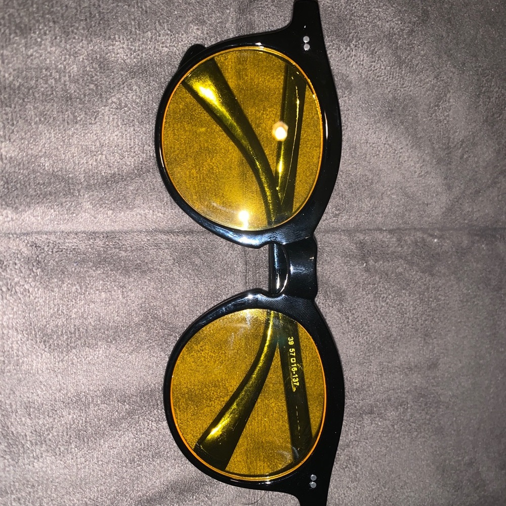 Black yellow lens glasses